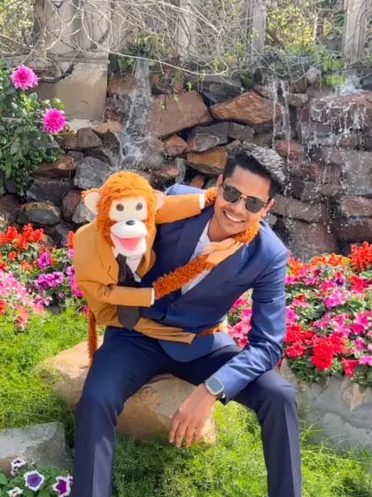A moment of peace with Rancho in a beautiful garden. The vibrant flowers provide a perfect, natural backdrop.