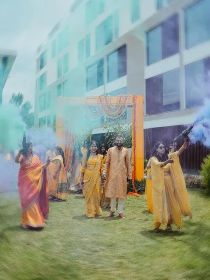 A grand entrance with colored smoke bombs, creating a vibrant and energetic start to the Haldi ceremony.