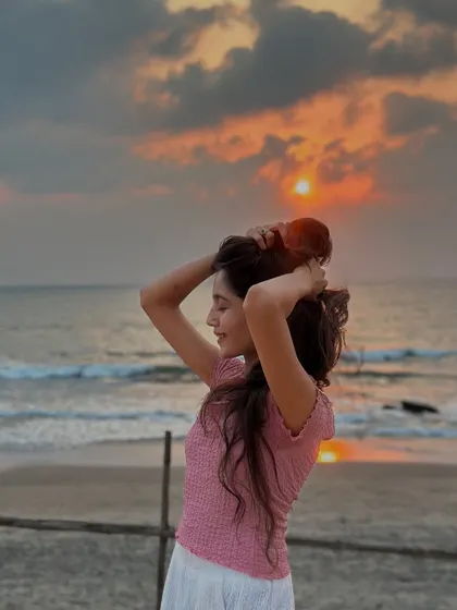 Getting my hair ready for a sunset photo on the beach. We always have fun taking pictures and capturing the beautiful scenery.