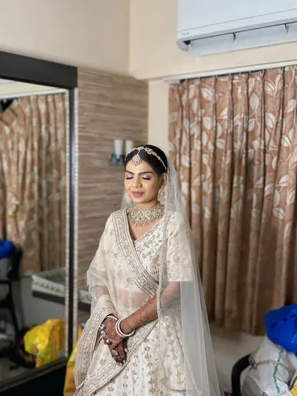 A final look before heading to the ceremony. The soft, natural light beautifully captures the serene and elegant bridal style we created.