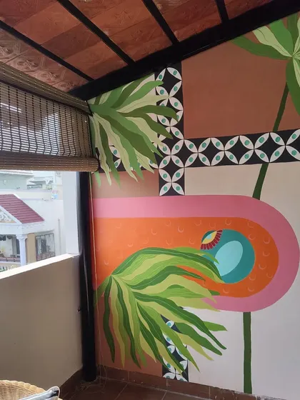 This mural was painted on a balcony, adding a burst of color and pattern to the outdoor space.