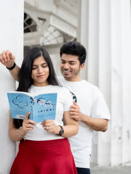 A candid moment of a couple sharing a book, showcasing their shared interests and connection. My goal is to create photos that feel like a natural extension of their relationship.