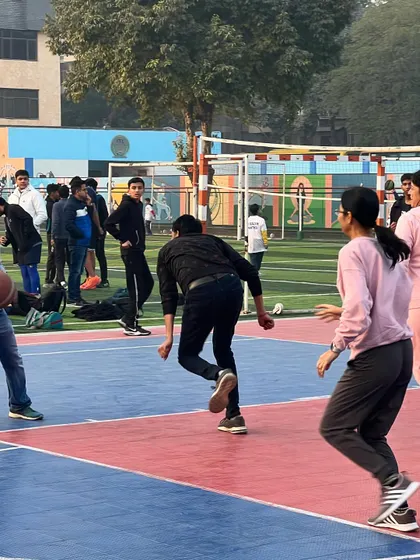 Parents in action during the fun match. It's great to see adults getting active, laughing, and enjoying some friendly competition on the court.