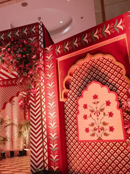 Another view of the culturally themed photo wall, showing the intricate patterns and the beautiful archway design.