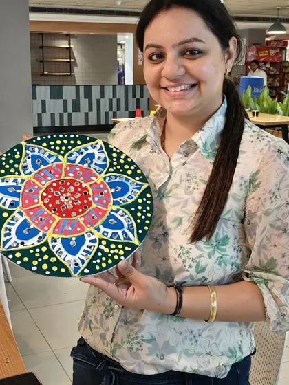 The smile of a proud artist says it all. This participant is showing off her beautifully detailed and colorful Lippan art piece. My goal is for every person to leave the workshop with a creation they are genuinely proud of.