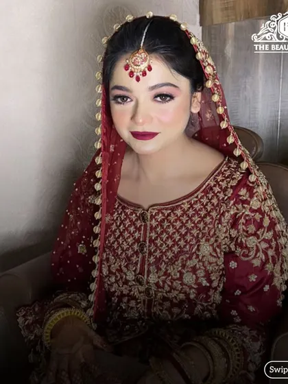 The addition of the dupatta completes this traditional bridal look. The makeup is bold enough to stand out while remaining elegant and timeless.