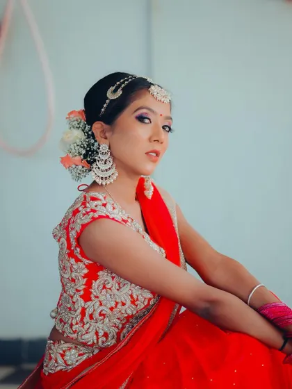 A portrait that highlights the bride's beautiful hair, adorned with flowers. The side angle provides a great view of the complete look.