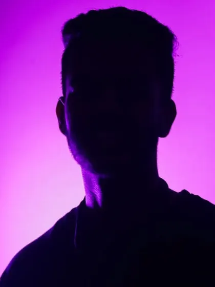 A creative silhouette self-portrait using purple light. I enjoy playing with colors and shadows to create aesthetic and moody images.