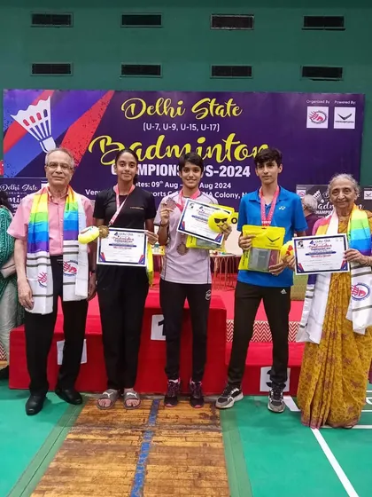 A group of my mixed doubles and singles players on the podium. Training them to excel in different formats is a core part of my coaching philosophy.