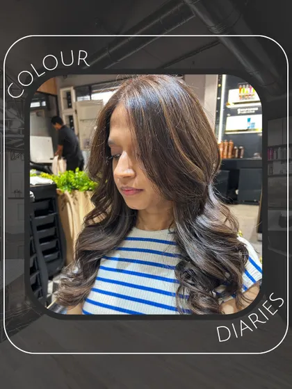 A side view of the "Colour Diaries" look, showing the seamless color and the expertly styled layers that create a full, healthy appearance.
