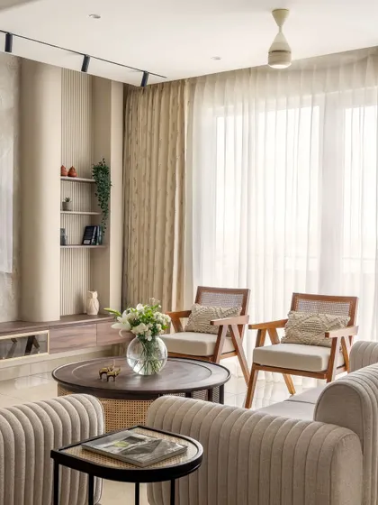 Natural light floods this living room corner, highlighting the clean lines of the minimalist cane chairs. This nook is a perfect example of how I use thoughtful furniture placement to create quiet, comfortable moments.