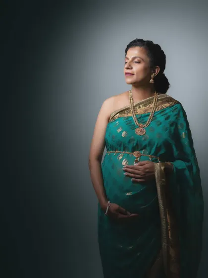 Timeless grace in tradition. This portrait, wrapped in a timeless saree, whispers of elegance and strength, blending heritage with the beauty of motherhood.