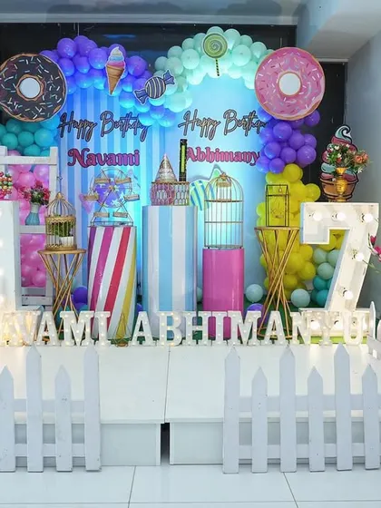 A super sweet Candyland theme, filled with giant donuts, ice cream cones, and lollipops.