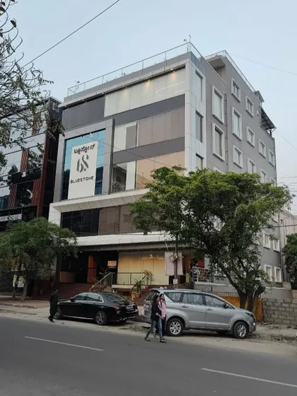 Another street view of the completed commercial building, highlighting its modern elevation and the active retail environment at ground level.