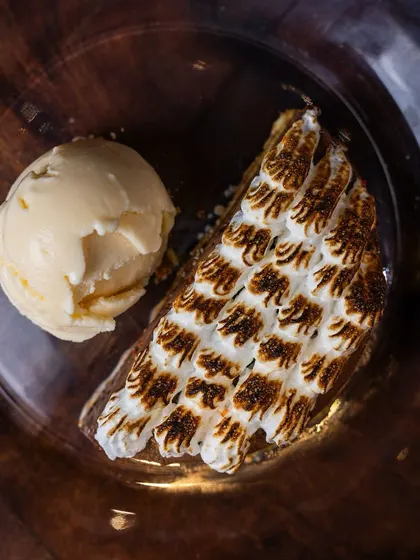 My Hazelnut Chocolate dessert served with a scoop of ice cream. The contrast of the rich, dark chocolate and the cool, creamy ice cream is a match made in heaven.
