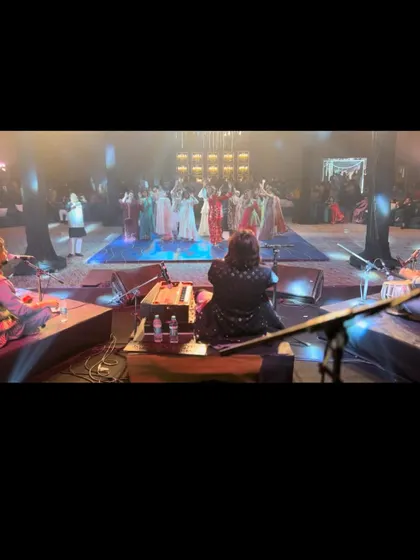 Another perspective from the stage, showing the beautiful lighting and the crowd enjoying the performance. Every detail contributes to the overall atmosphere of the event.