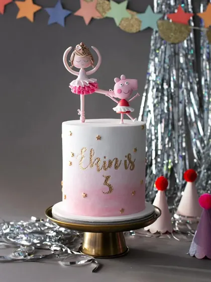 A fun and playful cake for a 5th birthday, featuring a ballerina and Peppa Pig dancing together.