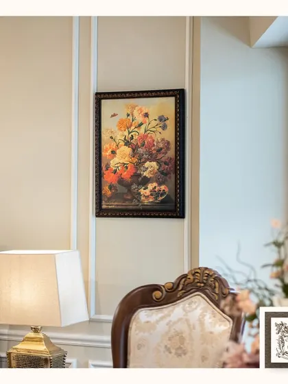 This vintage floral painting, with its rich colors and classic composition, adds timeless charm and warmth to any space. It's a perfect touch of artistry for a traditional living room.
