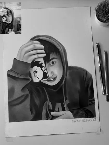A creative and modern A3 graphite portrait. The way he holds the phone with his own sketch on it was a unique idea from the client that I was happy to bring to life.