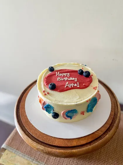 A simple and modern cake for Appa's birthday. This blueberry lemon curd cake is decorated with abstract buttercream swipes of color and fresh blueberries.