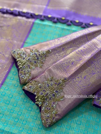 Purple brocade sleeves with delicate zardosi cuffs.