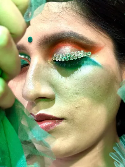 A close-up of my conceptual Independence Day makeup. This shot highlights the detailed application of crystal embellishments along the lash line, set against a tricolor blend of eyeshadow. It demonstrates my ability to execute artistic and thematic concepts with precision.
