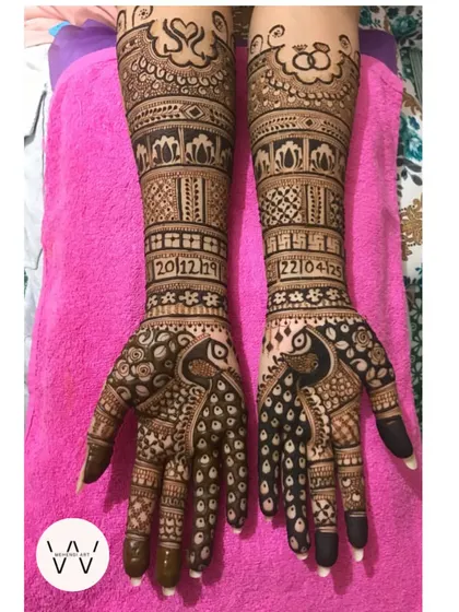 This engagement design is all about celebrating love. The full-arm pattern includes the couple's initials, important dates, and symbols of their union like engagement rings.