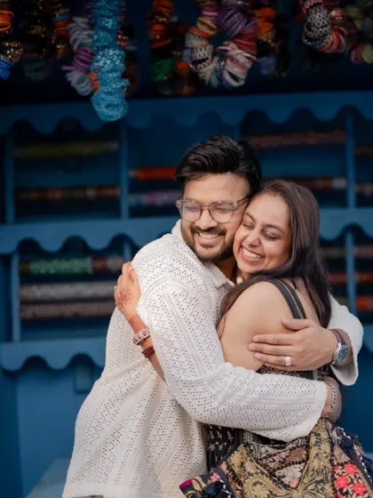 A warm and genuine hug shared by the couple during their pre-wedding shoot, capturing the comfort and love they have for each other.