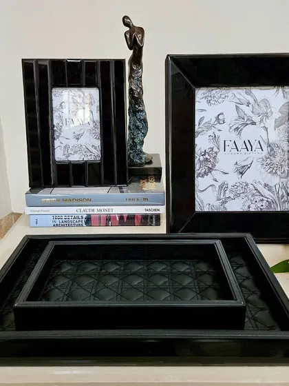 Elevate your tableware with our luxurious Amadeus Bevelled Glass Trays. This set in black features a quilted leather interior, adding a layer of texture and opulence to your serving collection.