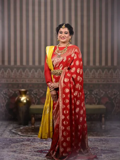 A full-length shot that captures the royal essence of this look. It is a perfect example of how to style for a grand, traditional theme.