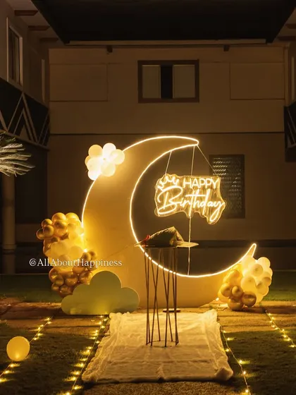 The moon backdrop is a statement piece on its own. Here it is set up with a small table for the cake, creating a perfect focal point for the party.