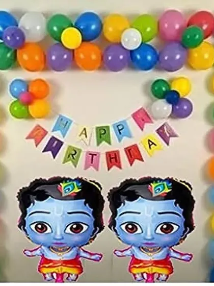 A simple and colorful home decoration for a Krishna-themed birthday, featuring a balloon arch and two large Krishna foil balloons.