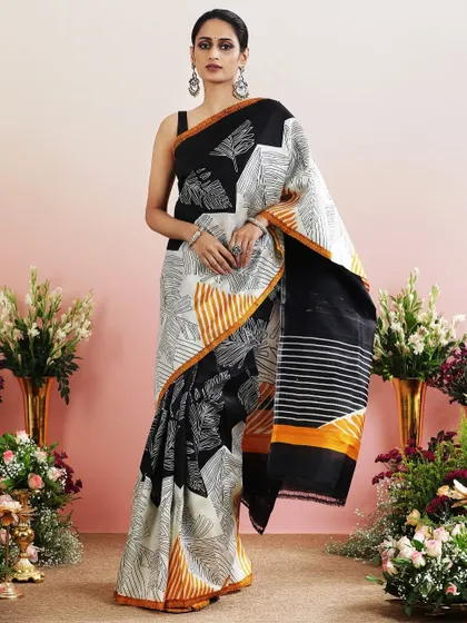 The full view of the black and white leaf print saree, a chic and contemporary choice.