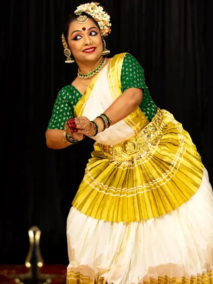 A joyful pose from one of our student's solo performances, reflecting the culmination of her dedicated training.
