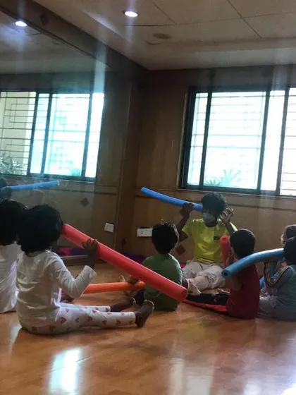 A look at our outdoor program, where we bring "Serious Fun" right to your apartment's doorstep. These images show kids enjoying gymnastics and yoga on mats in both indoor and outdoor community spaces.