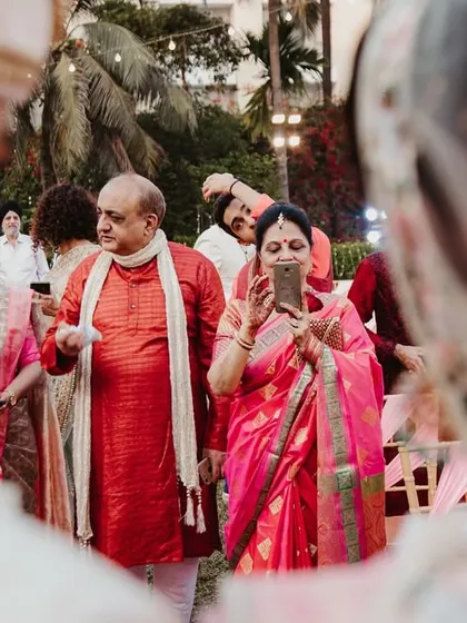 A guest's perspective, capturing the ceremony from between the couple, showing how everyone is a part of this special moment.