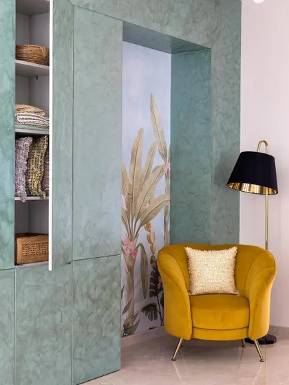 Another view of the concealed storage in the foyer, with the door slightly ajar to show the practical shelving inside.