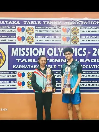 S Kiran Ashish and Sahana H Murthy with their trophies from the Mission Olympics league.