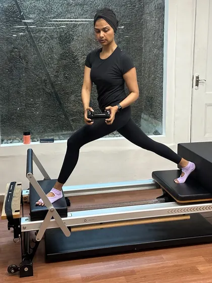 Various shots of members and instructors in action during our dynamic Reformer Pilates classes.