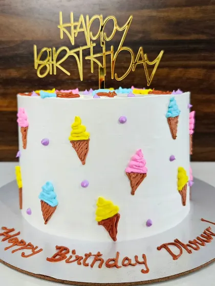 A no-fondant ice cream cone cake for Dhruv's birthday. This lemon blueberry cake is decorated with cute, piped ice cream cones.
