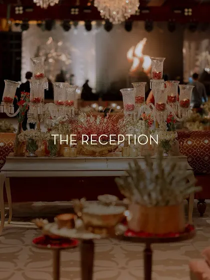 A title card for 'The Reception', set against a backdrop of traditional Indian decor elements, signaling a grand and culturally rich celebration.