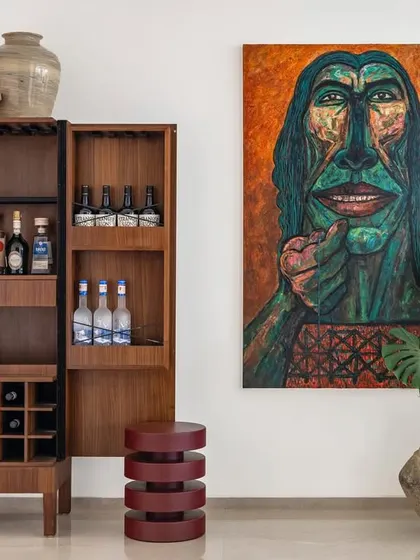 A custom bar cabinet designed for Apartment 1600. This functional piece also serves as a display for art and decor, reflecting the client's personal style.