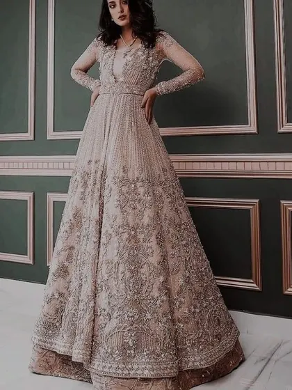 The same gown, styled to show its full silhouette. I work to ensure that even the most heavily embellished outfits are structured for a flattering fit.