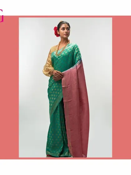 This elegant green silk linen saree features a contrasting pink pallu, offering a fresh and sophisticated color story within the Aadya collection.