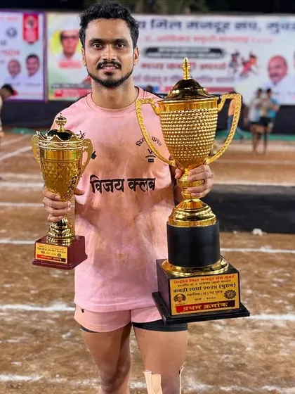 Our player proudly displaying his 'Best Player' trophies after the tournament.