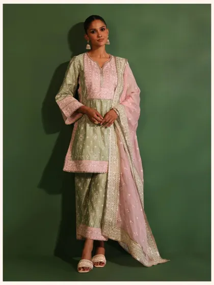 This unique green and pink kurta set is a perfect example of my playful approach to color. It’s a festive outfit that is sure to get you noticed.