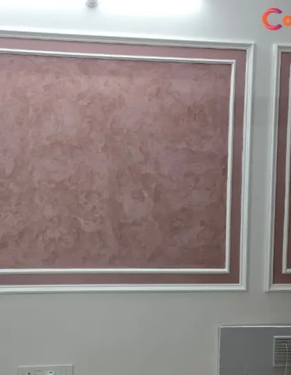 We used a Drizzle Dune texture in a soft mauve tone within classic white beading frames. This combination creates elegant, textured panels that serve as subtle artwork for the wall.