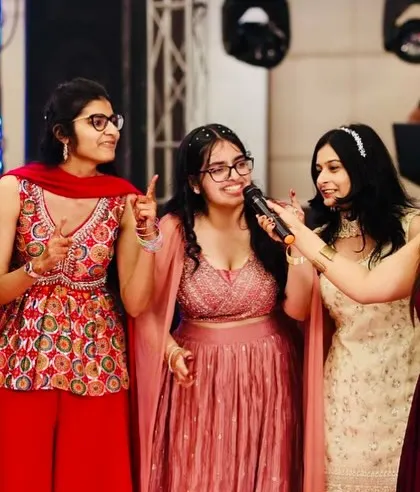 Getting into the crowd and interacting with the bridesmaids during a Sangeet. It's all about making sure everyone feels included in the fun.