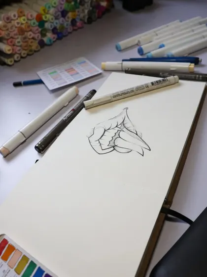 Another angle of the vampire lips line art, showing my art supplies in the background. A clean sketch is the foundation for a great colored piece.