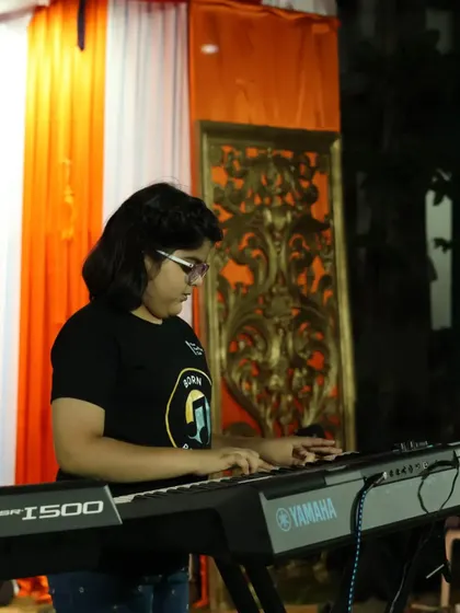 **Focused and Ready.** Another one of our students at a live event, focused on her performance. These real-world experiences are a crucial part of becoming a true performer.